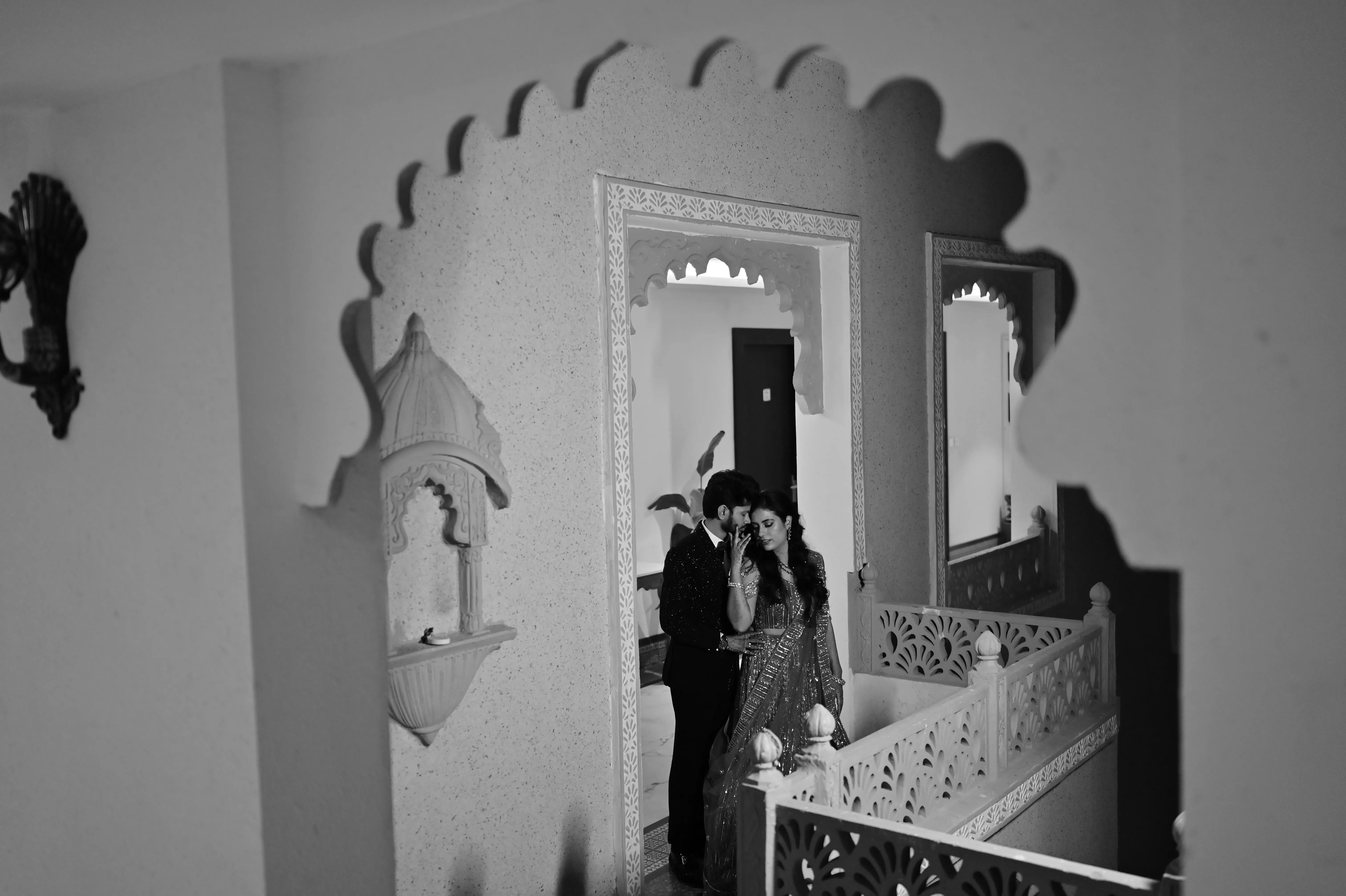 A creative photoshoot of a couple on their wedding day, captured by Fotographiya