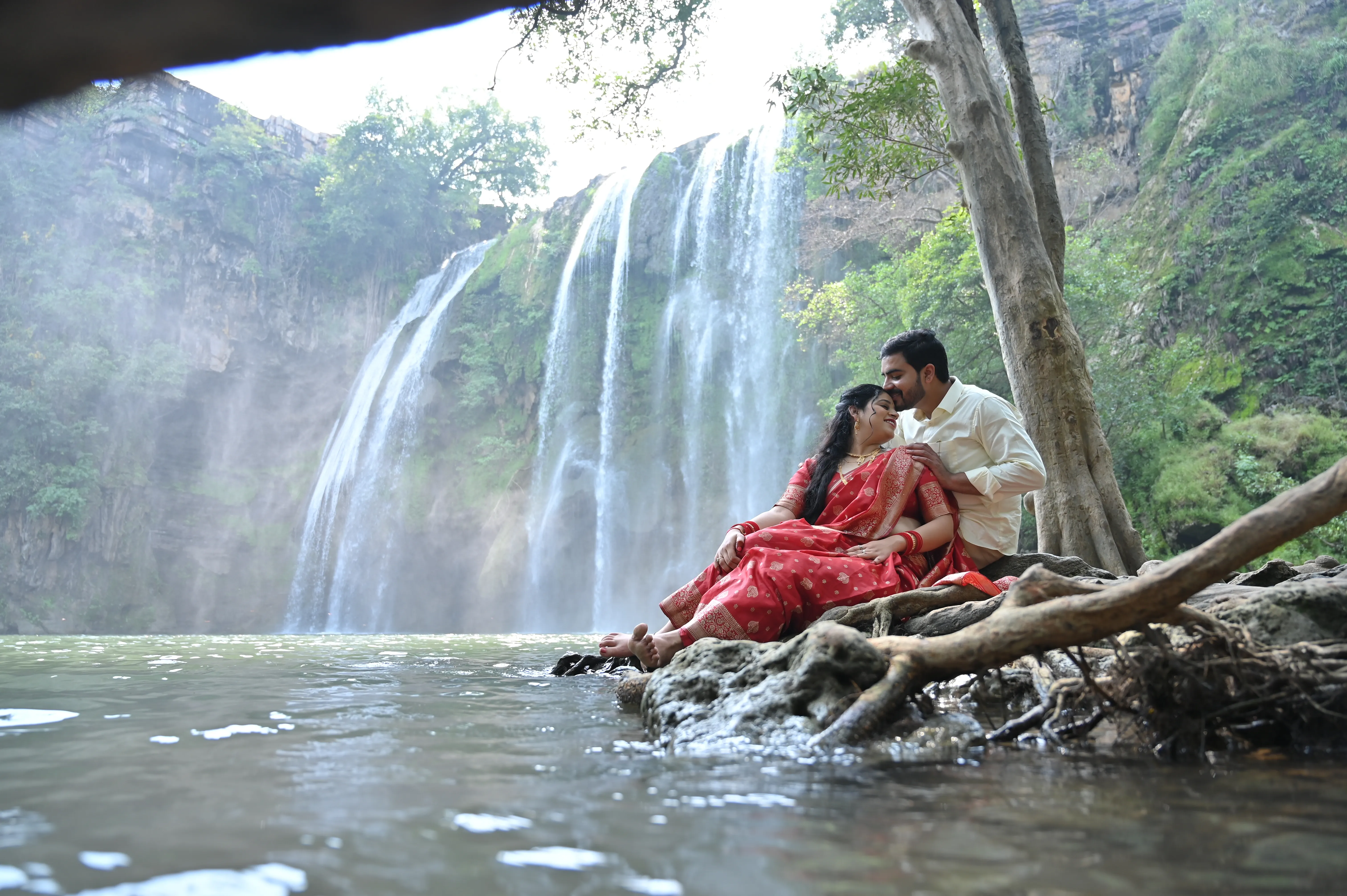 A creative pre-wedding photoshoot of a couple during sunset, captured by Fotographiya